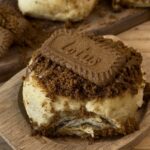 Freshly baked Biscoff rolls, golden brown and swirled with rich Biscoff spread,topped with crunchy Lotus biscuit pieces, adding a delightful texture to the soft, golden swirls