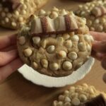 Closeup of a gooey Kinder Bueno cookie with melted white chocolate chips