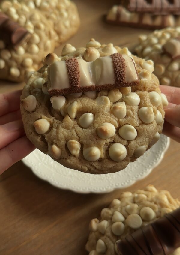 Closeup of a gooey Kinder Bueno cookie with melted white chocolate chips