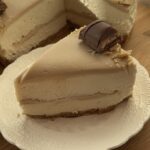 A slice of no-bake Kinder Bueno cheesecake, showcasing its creamy texture and rich Kinder Bueno layers.